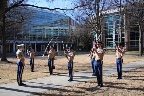 soldiers presenting arms